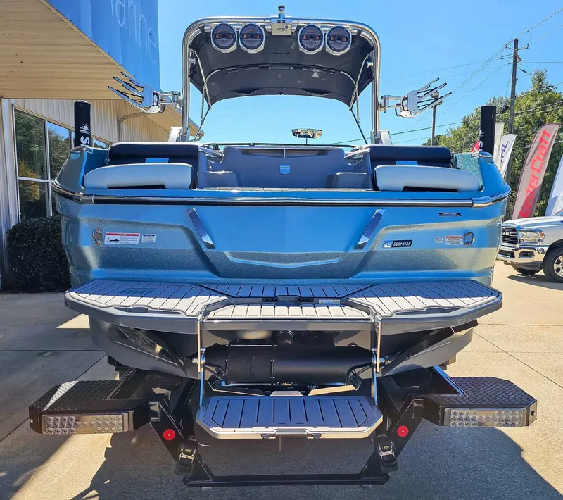 Slide: The Image of Rear view of 2023 MasterCraft X26 boat on a trailer. - 8