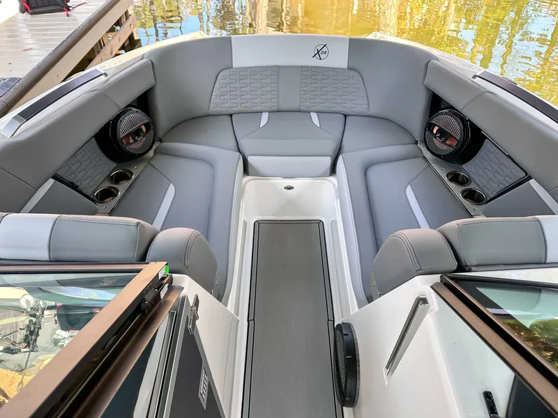 Slide: The Image of Interior of 2024 MasterCraft X24 boat with gray upholstery. - 13