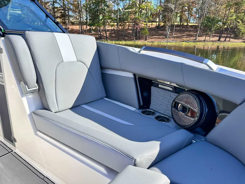 Slide: The Image of 2024 MasterCraft X24 interior with gray seating and speaker. - 15