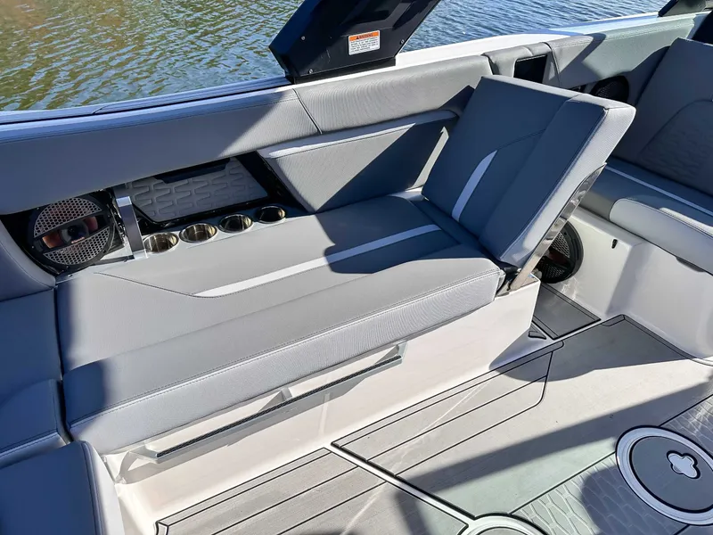 Slide: The Image of Interior of 2024 MasterCraft X24 with gray seating and cup holders. - 17