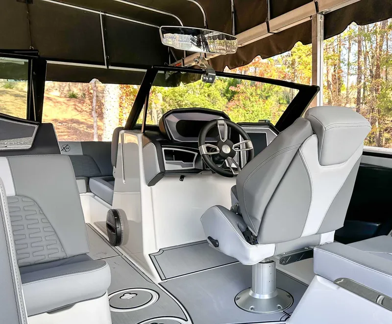 Slide: The Image of Interior of 2024 MasterCraft X24 boat with modern helm station. - 18