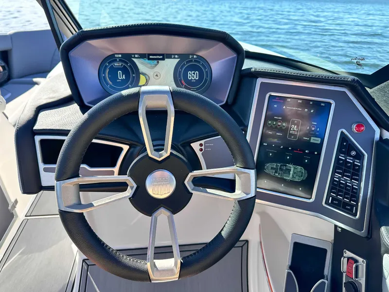 Slide: The Image of 2024 MasterCraft X24 steering console with digital display. - 20