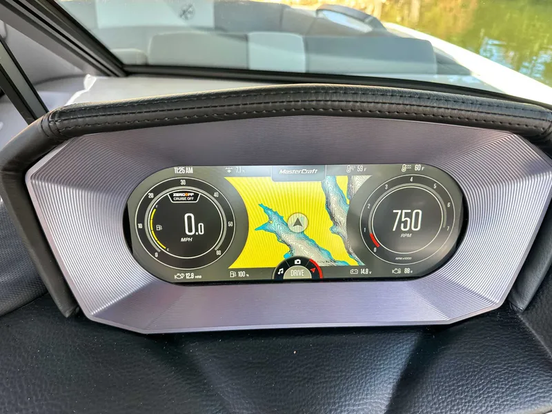 Slide: The Image of 2024 MasterCraft X24 dashboard with digital display. - 21