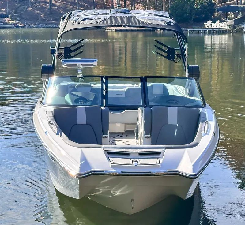 Slide: The Image of 2024 MasterCraft X24 boat on calm water. - 3