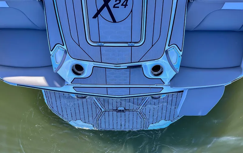 Slide: The Image of Rear view of 2024 MasterCraft X24 on the water. - 8