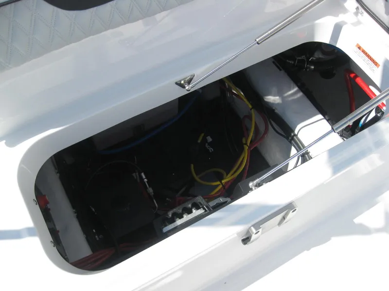 Slide: The Image of 2024 Blackfin 232 DC boat interior with seating and storage. - 12