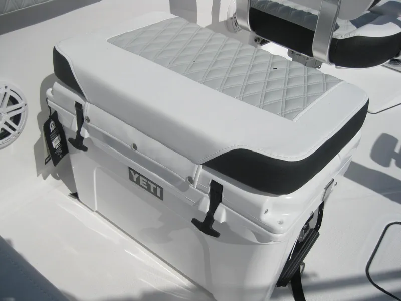 Slide: The Image of 2024 Blackfin 232 DC boat interior with cushioned seating. - 13