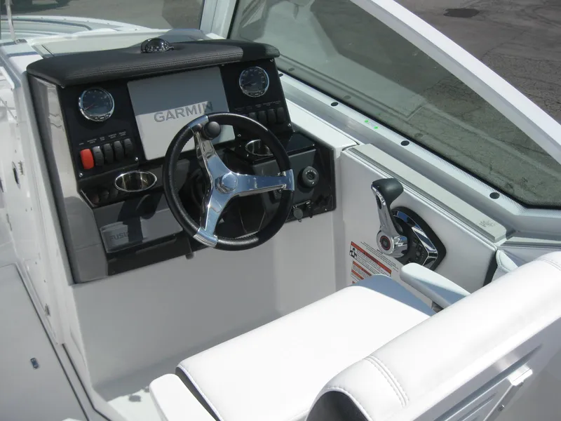 Slide: The Image of 2024 Blackfin 232 DC boat storage compartment with wiring and battery. - 14