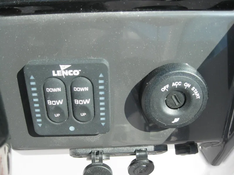 Slide: The Image of 2024 Blackfin 232 DC boat cockpit with Garmin navigation system and steering wheel. - 16