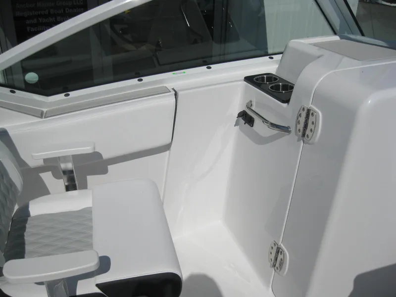 Slide: The Image of 2024 Blackfin 232 DC dashboard with Garmin display and control switches. - 17