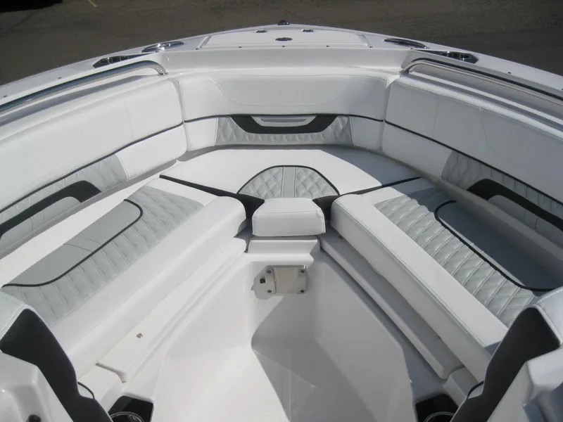 Slide: The Image of 2024 Blackfin 232 DC storage compartment with black cover. - 21