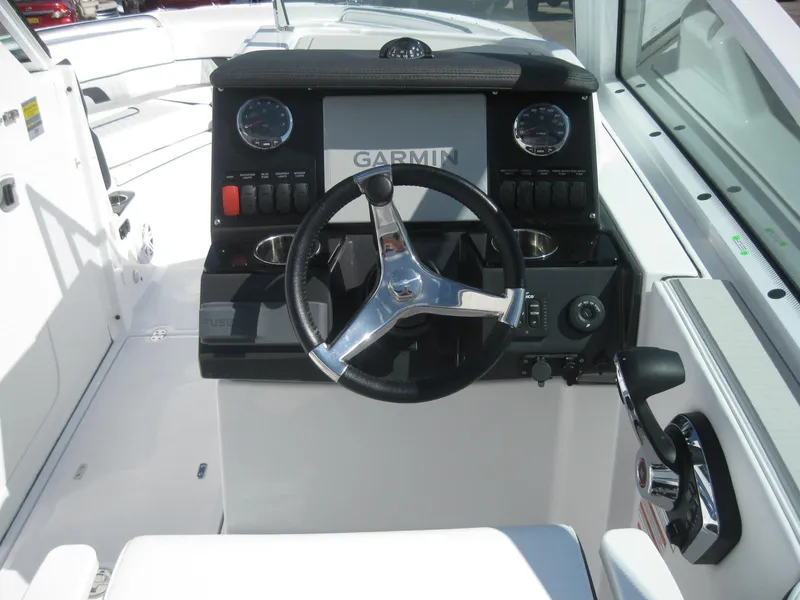 Slide: The Image of 2024 Blackfin 232 DC boat interior with white seating and modern design. - 25