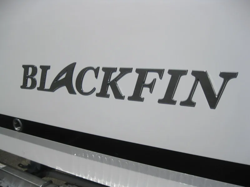 Slide: The Image of 2024 Blackfin 232 DC boat on trailer outside Anchor Marine Group. - 3