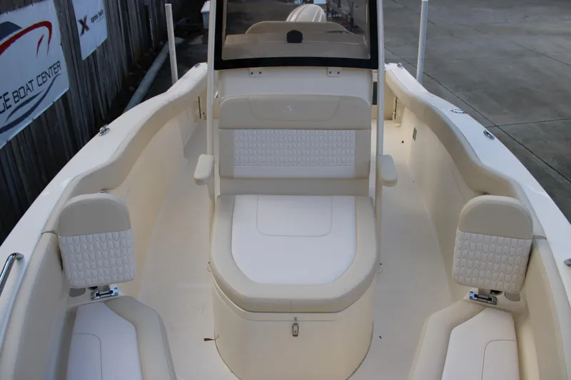 Slide: The Image of 2026 Scout 220 XSF boat interior with beige seating and modern design. - 12