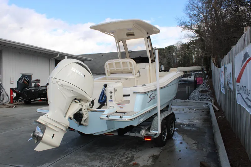 Slide: The Image of 2026 Scout 220 XSF boat with Yamaha outboard motor on trailer. - 3