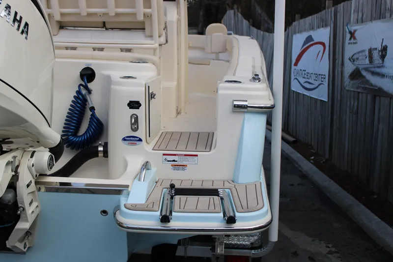 Slide: The Image of 2026 Scout 220 XSF boat with Yamaha engine and swim platform. - 5