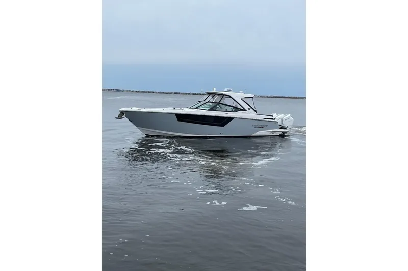 The Image of 2024 Monterey 385SS Super Sport boat cruising on calm waters. - 0