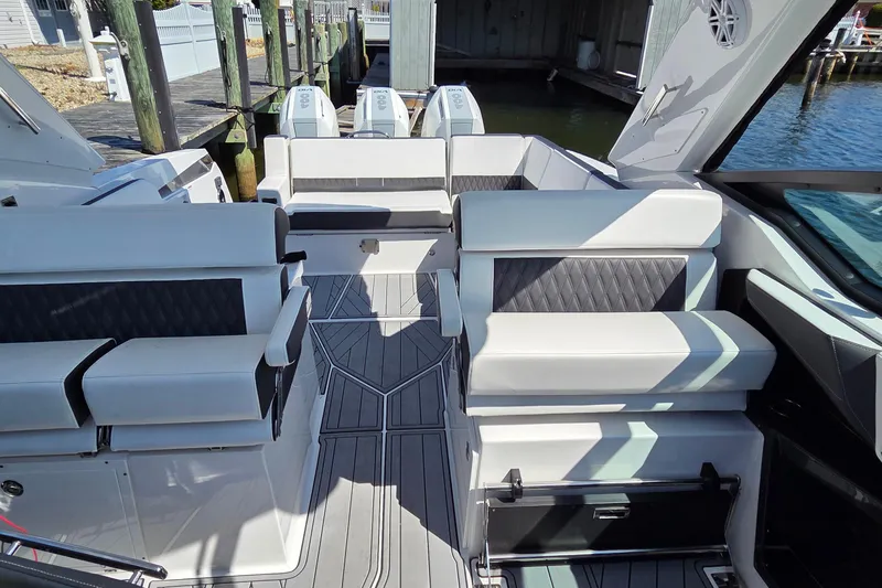 Slide: The Image of 2024 Monterey 385SS Super Sport boat interior with luxurious seating and modern design. - 10