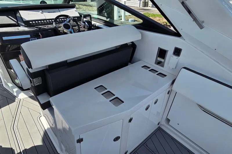 Slide: The Image of 2024 Monterey 385SS Super Sport boat interior with sleek seating and modern dashboard design. - 12