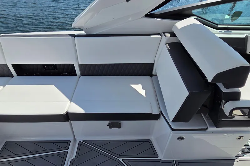 Slide: The Image of 2024 Monterey 385SS Super Sport boat interior with white and black seating. - 14