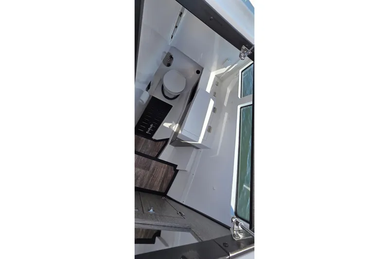 Slide: The Image of Interior view of 2024 Monterey 385SS Super Sport boat bathroom with modern fixtures. - 15