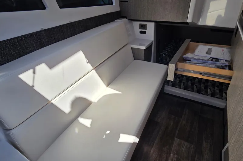 Slide: The Image of Interior of 2024 Monterey 385SS Super Sport with sleek seating and storage drawer. - 18
