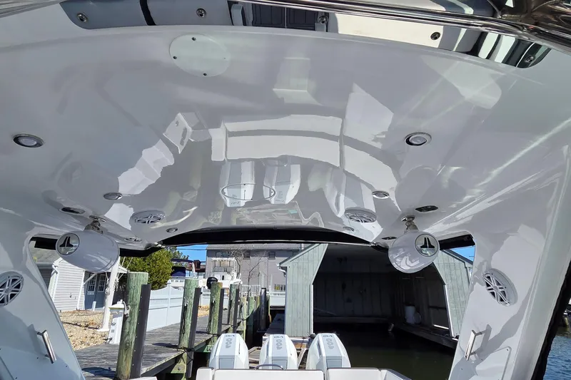 Slide: The Image of 2024 Monterey 385SS Super Sport boat interior with sleek design and modern lighting. - 20