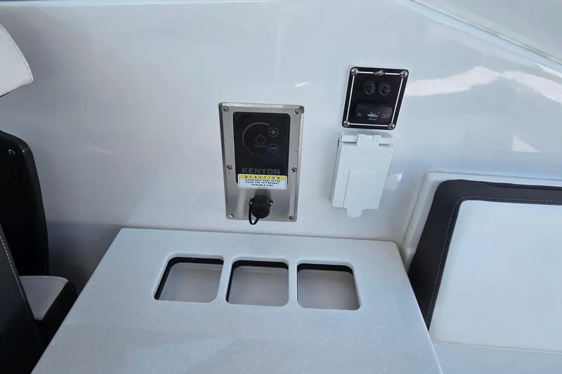 Slide: The Image of 2024 Monterey 385SS Super Sport boat interior with control panel and seating. - 21