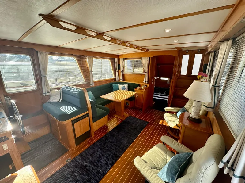 Slide: The Image of Interior of 1997 Sabre Cockpit Motor Yacht with elegant wood finish and cozy seating. - 15