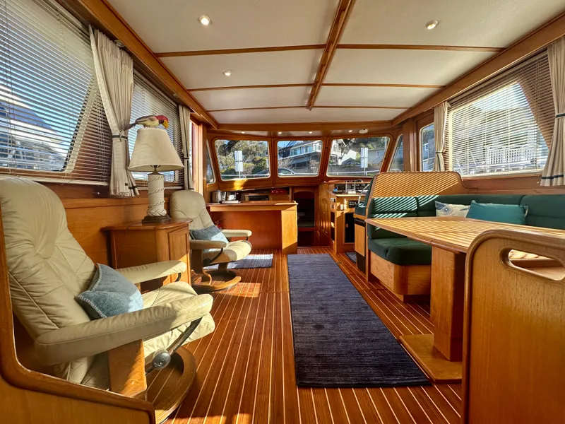 Slide: The Image of Interior of a 1997 Sabre Cockpit Motor Yacht with elegant wood finish and comfortable seating. - 16