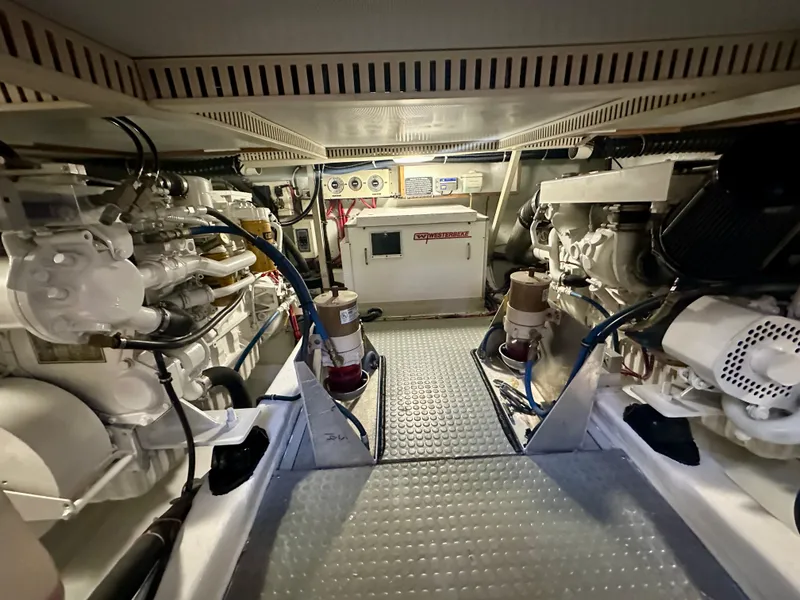 Slide: The Image of Engine room of a 1997 Sabre Cockpit Motor Yacht, showcasing mechanical components and systems. - 35