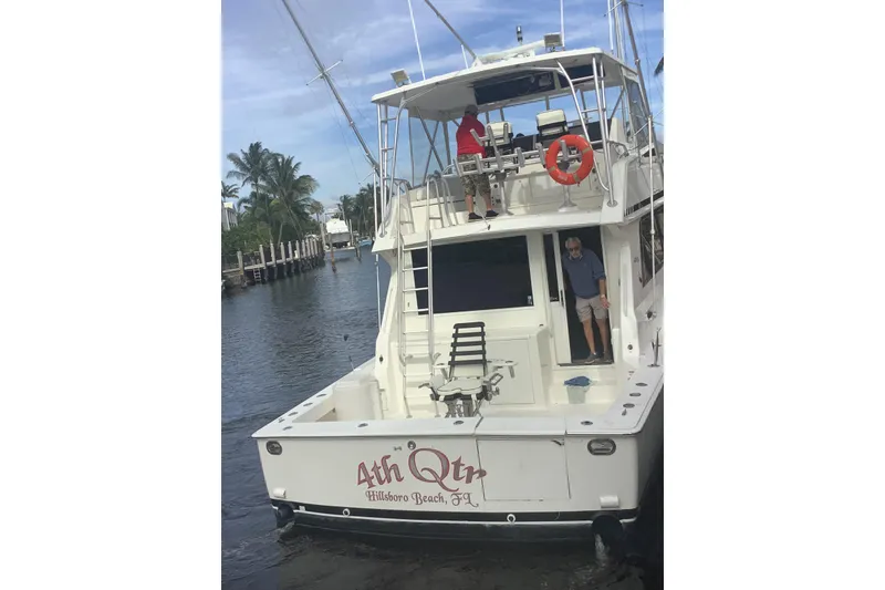 Slide: The Image of 1994 Viking 50' Convertible Sportfish boat docked, featuring "4th Qtr" name, Hillsboro Beach, FL. - 14