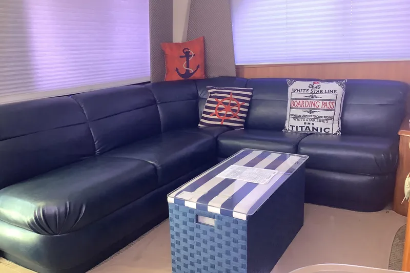 Slide: The Image of Luxurious interior of 1994 Viking 50' Convertible Sportfish with nautical-themed decor. - 15