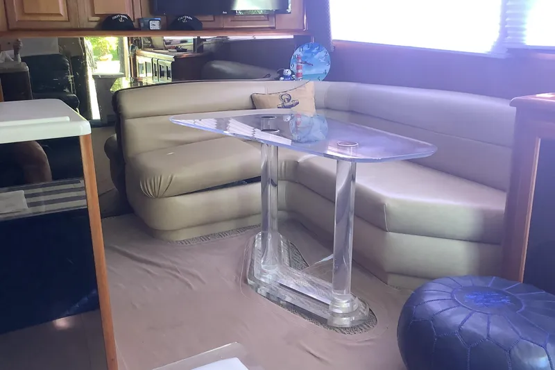 Slide: The Image of Luxurious interior of a 1994 Viking 50' Convertible Sportfish yacht with plush seating and glass table. - 17