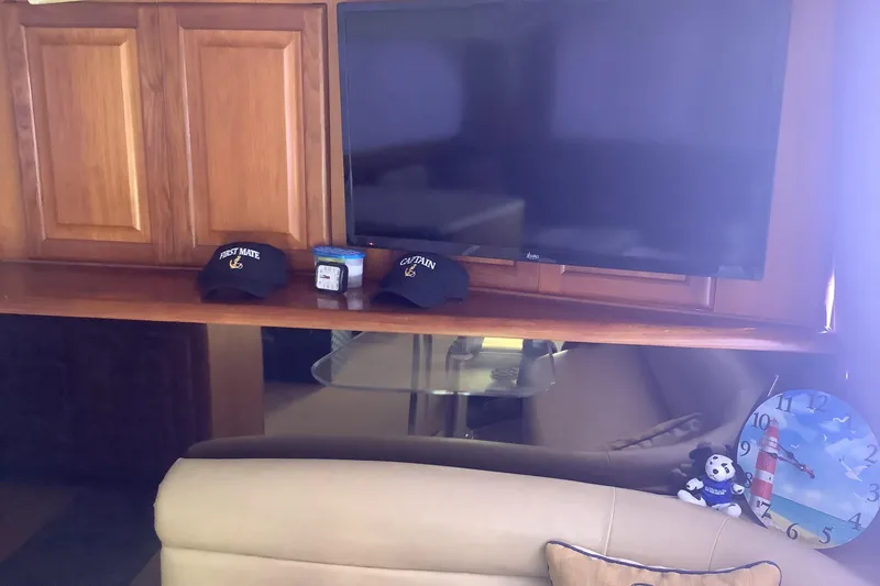 Slide: The Image of Interior of 1994 Viking 50' Convertible Sportfish with TV, hats, and nautical decor. - 18