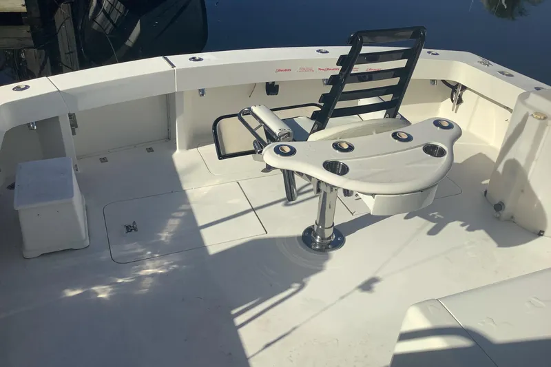 Slide: The Image of 1994 Viking 50' Convertible Sportfish cockpit with fishing chair and rod holders. - 2