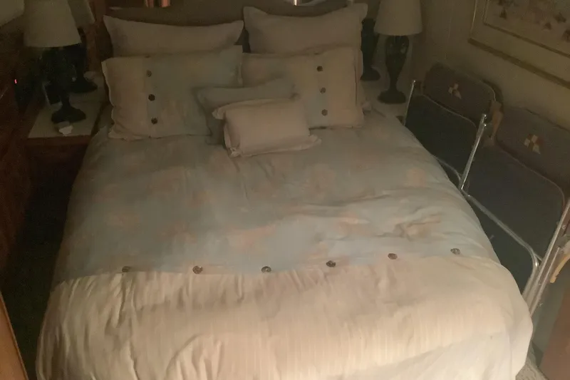 Slide: The Image of Cozy bedroom interior on a 1994 Viking 50' Convertible Sportfish yacht. - 21