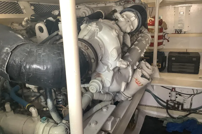 Slide: The Image of Engine room of a 1994 Viking 50' Convertible Sportfish boat, showcasing mechanical components. - 30
