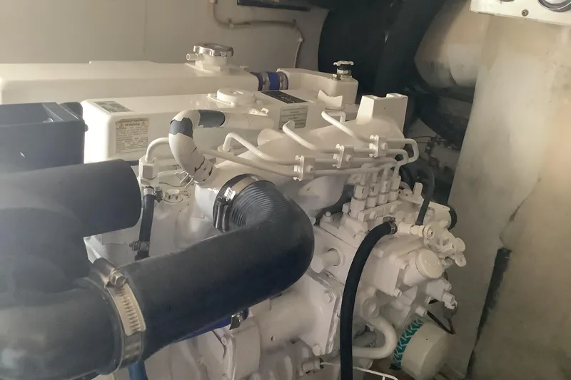 Slide: The Image of Engine room of a 1994 Viking 50' Convertible Sportfish boat, showcasing mechanical components. - 32