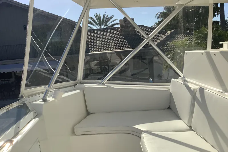 Slide: The Image of Interior view of a 1994 Viking 50' Convertible Sportfish boat with white seating. - 6
