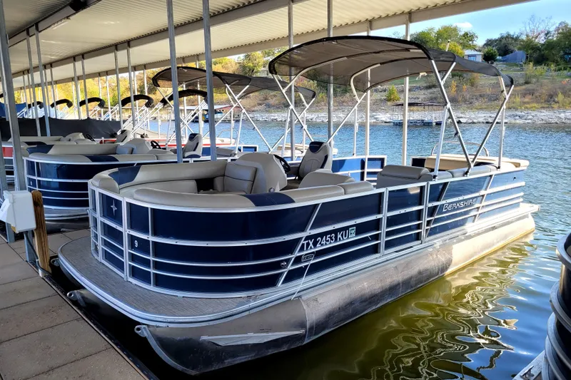 The Image of 2023 Berkshire 24CL LE 2.75 pontoon boat docked on a sunny day. - 1