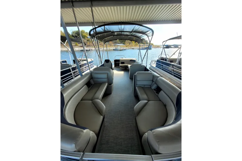Slide: The Image of 2023 Berkshire 24CL LE 2.75 pontoon boat interior with spacious seating and canopy. - 4