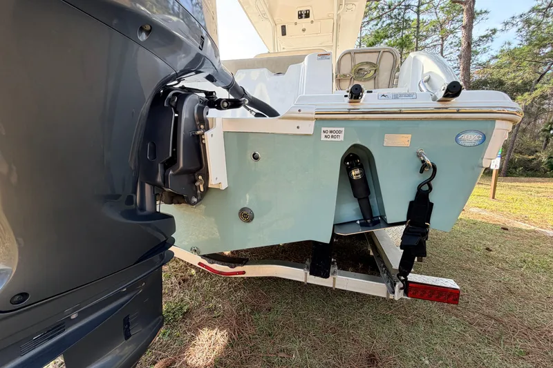 Slide: The Image of 2022 Sea Fox 228 Commander boat rear view with motor and trailer. - 13