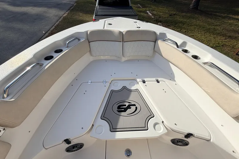 Slide: The Image of 2022 Sea Fox 228 Commander boat interior with cushioned seating and storage compartments. - 18