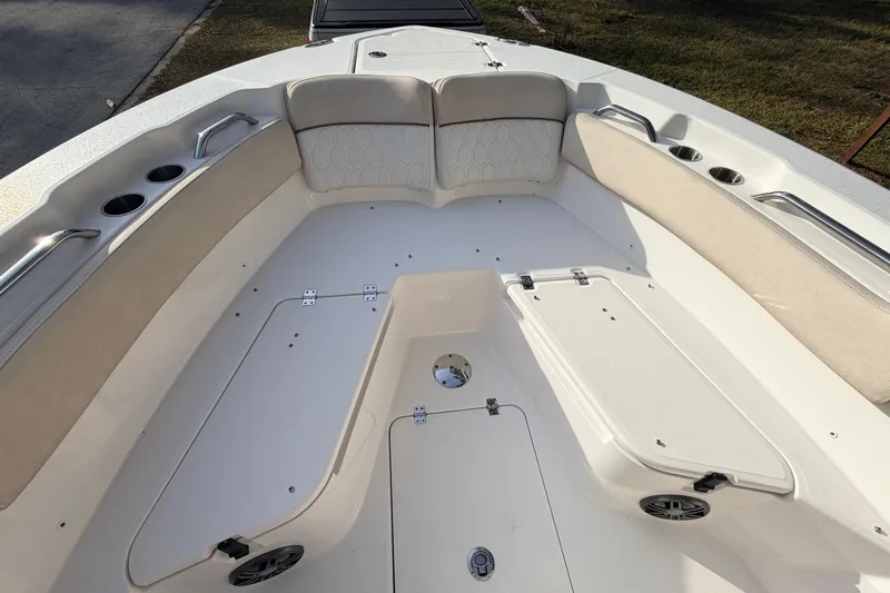 Slide: The Image of 2022 Sea Fox 228 Commander boat interior with cushioned seating and storage compartments. - 21