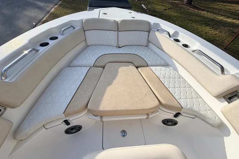 Slide: The Image of 2022 Sea Fox 228 Commander boat interior with cushioned seating and cup holders. - 23