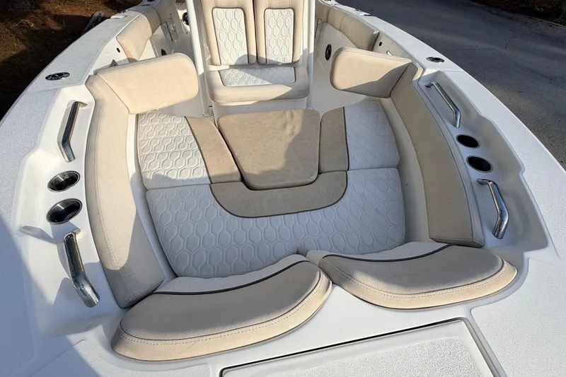 Slide: The Image of 2022 Sea Fox 228 Commander boat interior with cushioned seating and cup holders. - 25