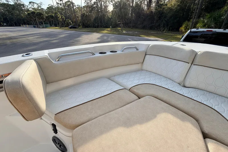 Slide: The Image of 2022 Sea Fox 228 Commander boat interior with beige and white cushioned seating. - 26
