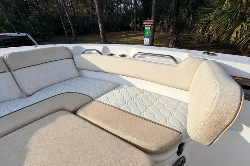 Slide: The Image of 2022 Sea Fox 228 Commander boat interior with beige and white cushioned seating. - 31