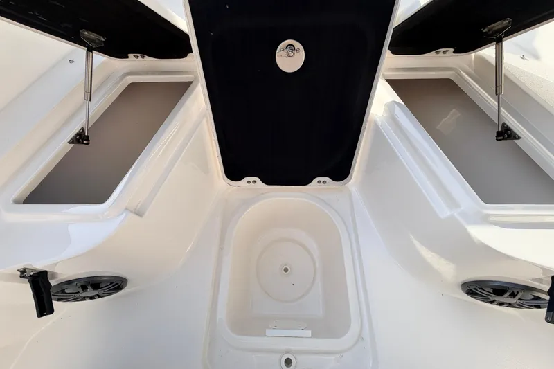 Slide: The Image of 2022 Sea Fox 228 Commander boat storage compartments and seating area. - 34